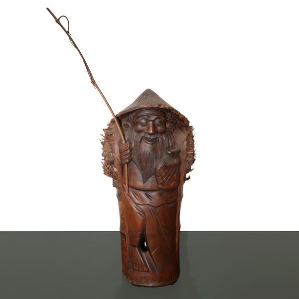 Bamboo cane wood sculpture of an old fisherman