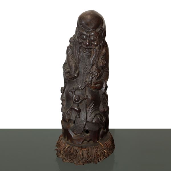 Sculpture of an old sage carved from bamboo root wood