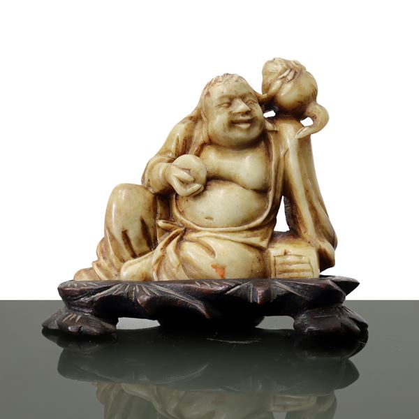Laughing Buddha in marble