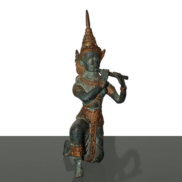 Patinated bronze flute player