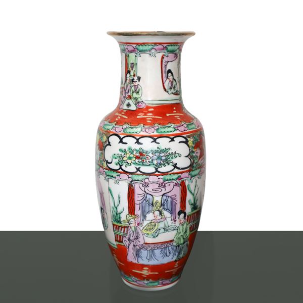 Chinese porcelain vase with polychrome floral motifs on white background