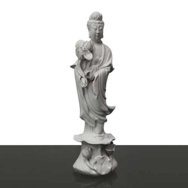 Three Chinese white porcelain figurines depicting Guanyin