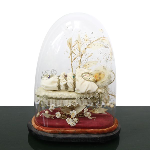 Child Madonna in wax model in glass case