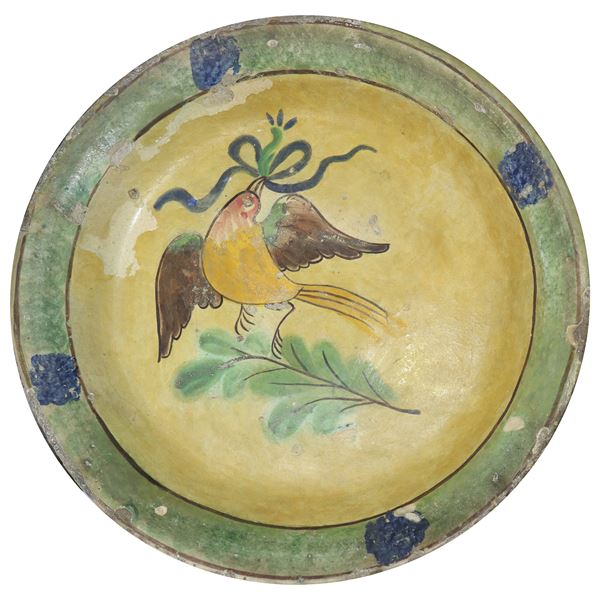 Piatto in maiolica di Caltagirone con raffigurazione di uccello
