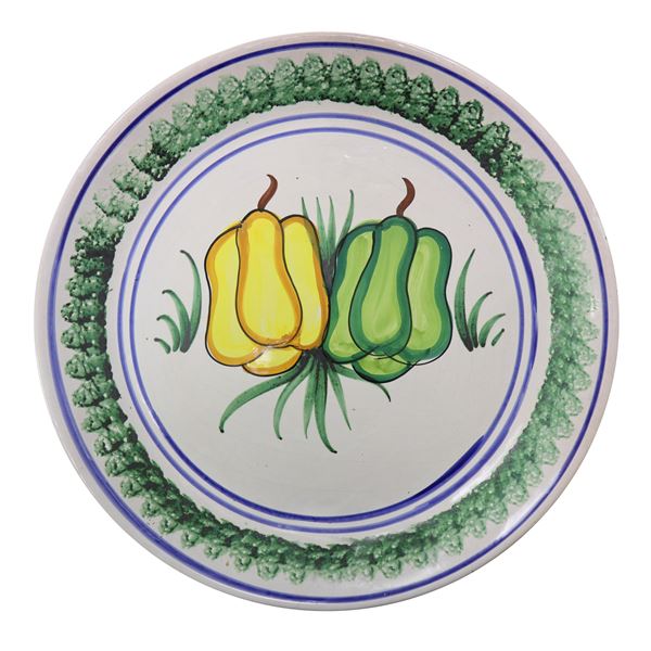 Sponge-coated Caltagirone majolica plate, painted with peppers