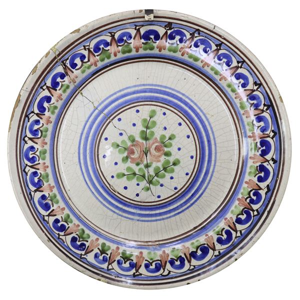 Caltagirone majolica plate, painted with two roses