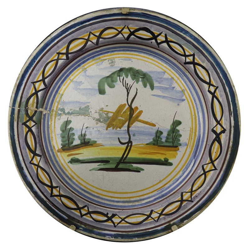 Piatto in maiolica di Caltagirone raffigurante paesaggio