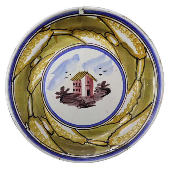 Piatto in maiolica di Caltagirone raffigurante casa,