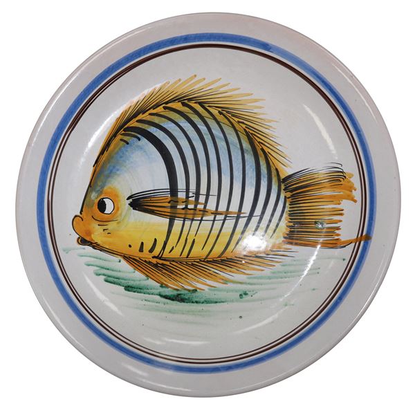 Polychrome Caltagirone majolica plate with a fish in the centre