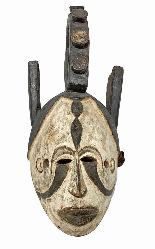 Igbo female mask, circa 1950. Nigeria. H 57 cm