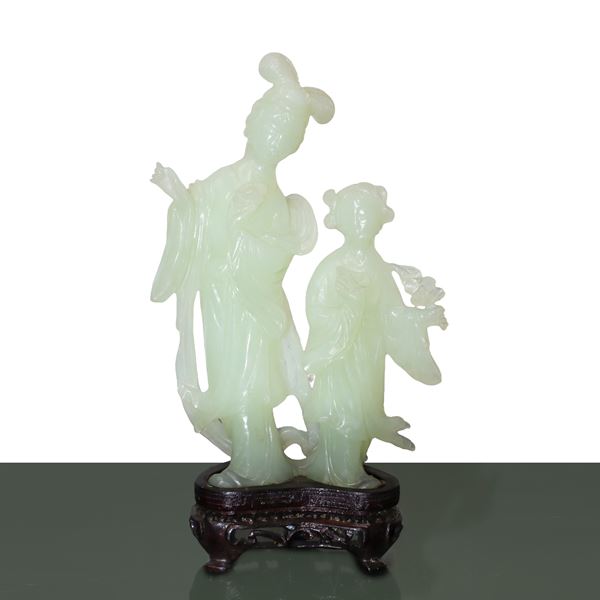 Figurine of two guanin mother and daughter in light green jade