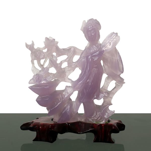 Guanin with fan and flowering branch in amethyst