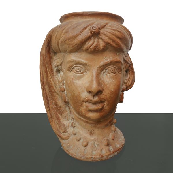 Terracotta vase depicting a woman's head with turban and earrings