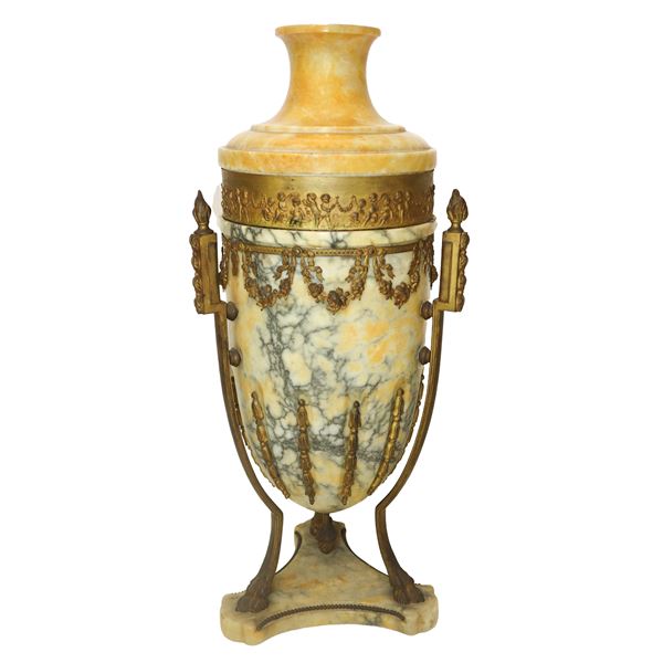 Alabaster vase and golden metal decorations of cherubs and garlands