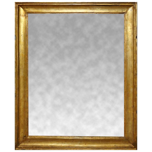 Mirror in half-cane frame in gilded wood