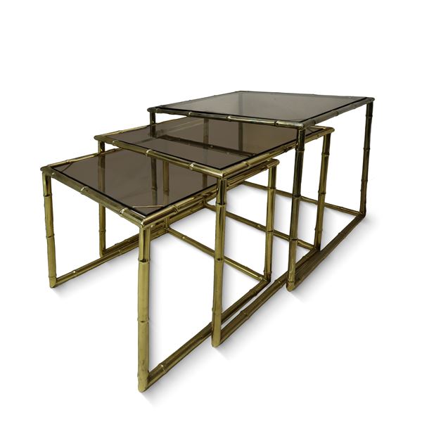 Triptych of golden brass coffee tables