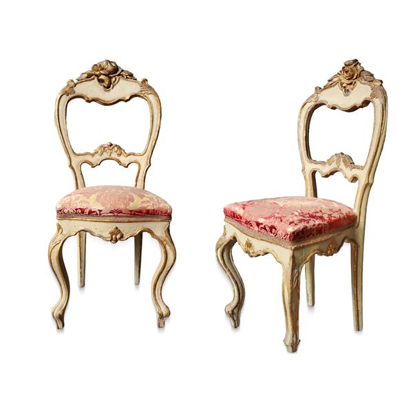 Pair of lacquered and gilded chairs