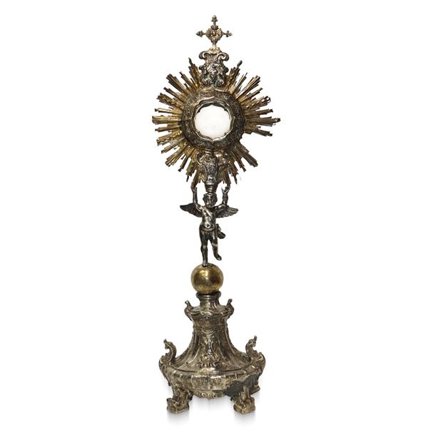 Monstrance in silver and silver vermeil with supporting angel on Globe
