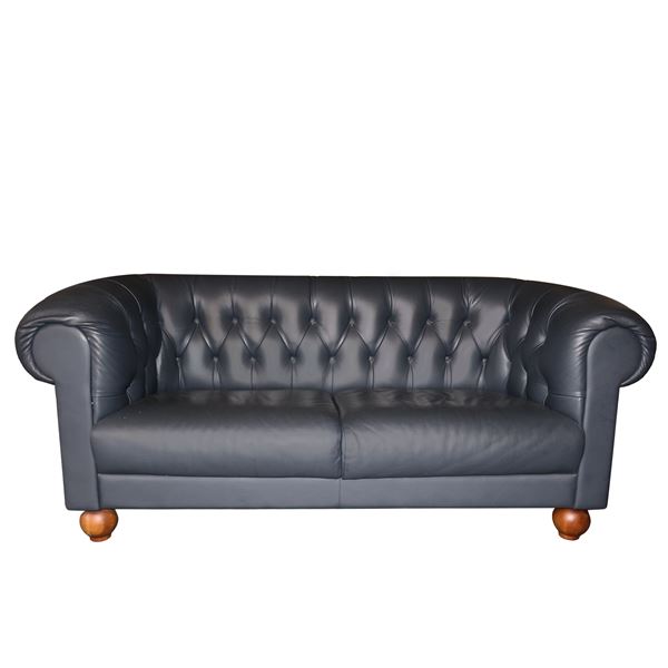 Blue leather two seater sofa