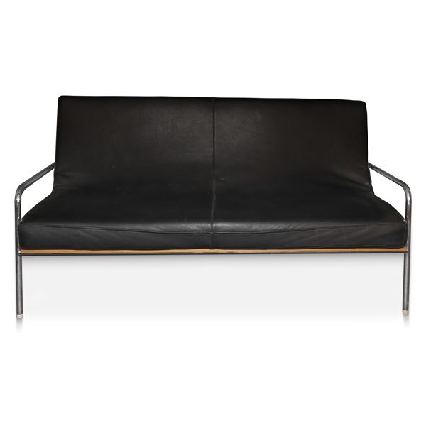 Sofa produced. Italia Alivar with chromed structure and black leather upholstery and light wood support backrest