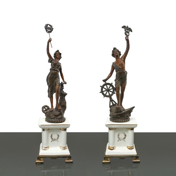 Pair of sculptural figures on a white porcelain base