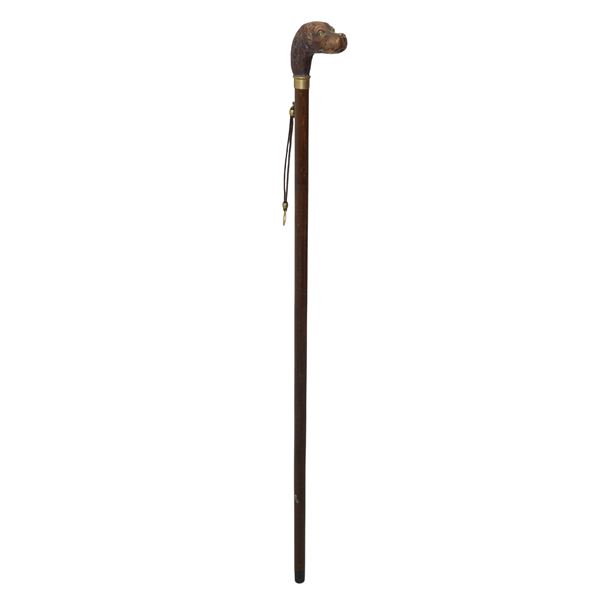 Wooden stick with dog head handle with glass eyes