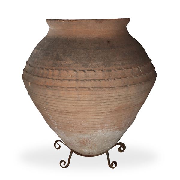 Large terracotta jar with iron base