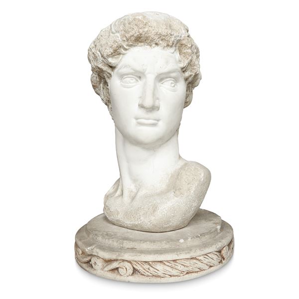 Head of a young Roman in reconstituted stone with round base