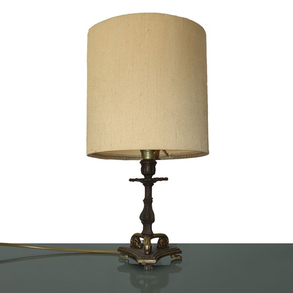 Lamp with brass tripod base with fabric lampshade