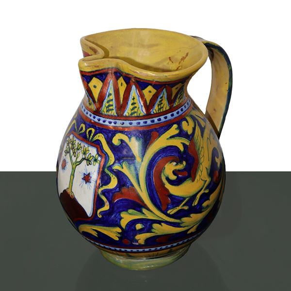 Renaissance style jug decorated in luster with central noble coat of arms.