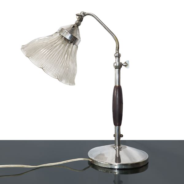 Table lamp in wood and steel with double butterfly joint.