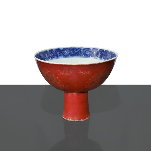 Bowl with stem in coral red glazed porcelain and blue glazed interior