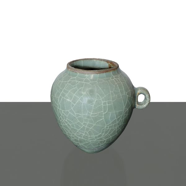 Green glazed cracked ceramic bird food jar