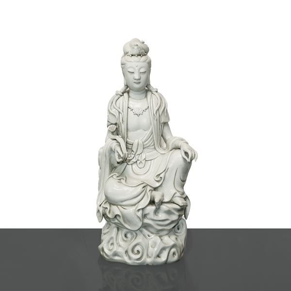 Chinese porcelain statue DeHua sitting on a throne