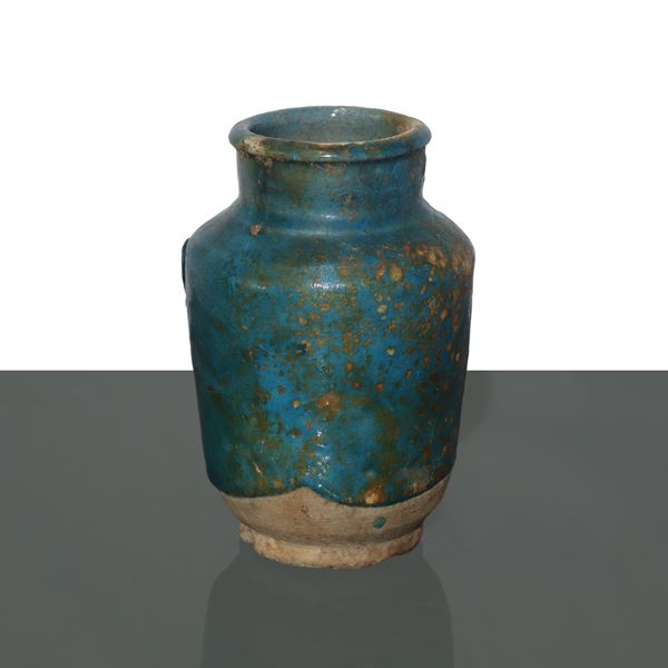 Small Persian ceramic albarello, with green glaze and traces of golden iridescent
