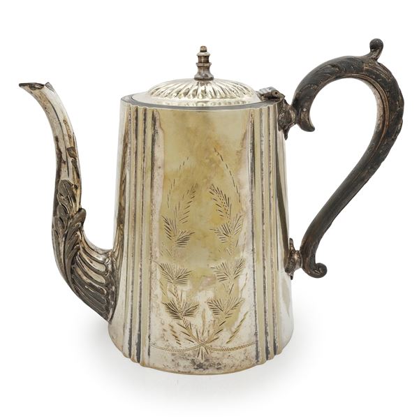 Silver teapot with vegetal decorations 