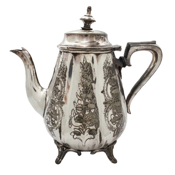 Silver-plated teapot with rounded sides and floral decorations