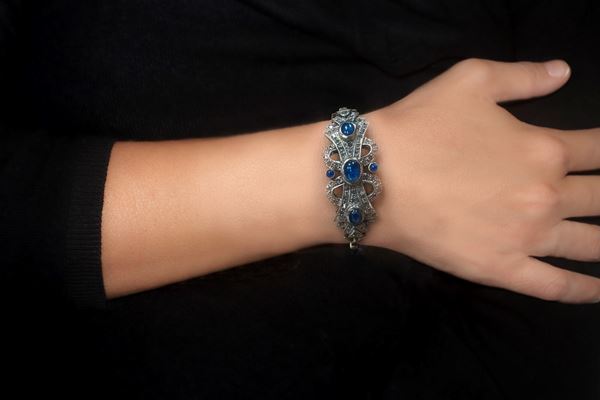 Rigid bracelet in 9 kt gold and silver with blue and brilliant stones