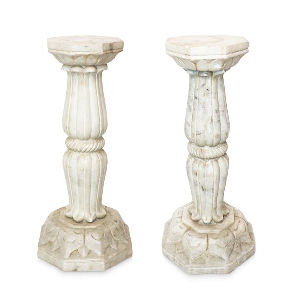 Pair of sculpted marble columns with octagonal base, corded column in the center and octagonal leaf capital