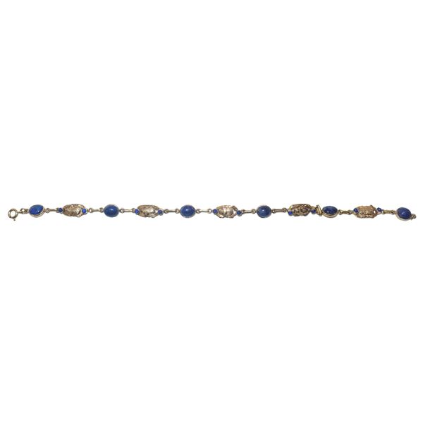 750 yellow gold bracelet with scarabs and lapis lazuli.