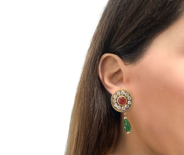 Chanel clip-on earrings decorated with rhinestones and a central cabochon stone in glass paste
