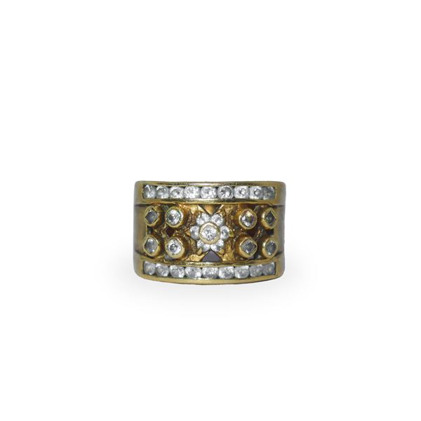 Gold band ring with transparent gems