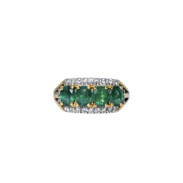 Gold ring with green stones