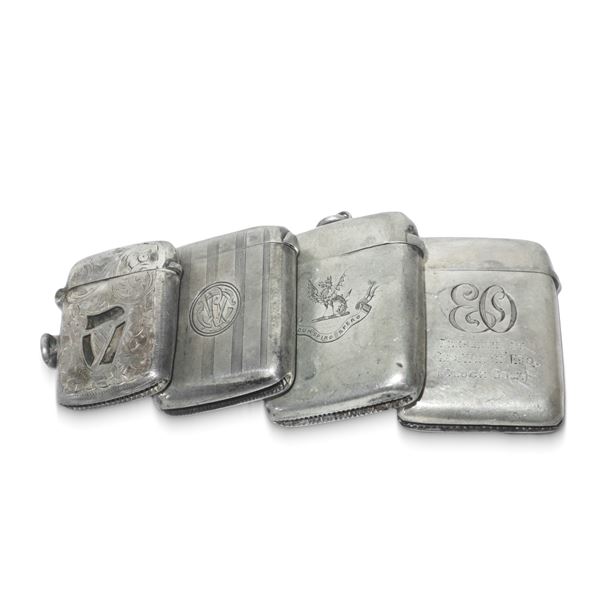 Four English silver match holders