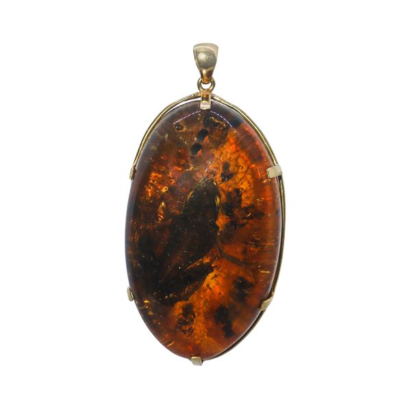 Amber pendant mounted on gold structure