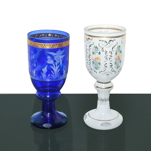 Two Murano glass glasses, one blue and one white, painted and engraved on the front