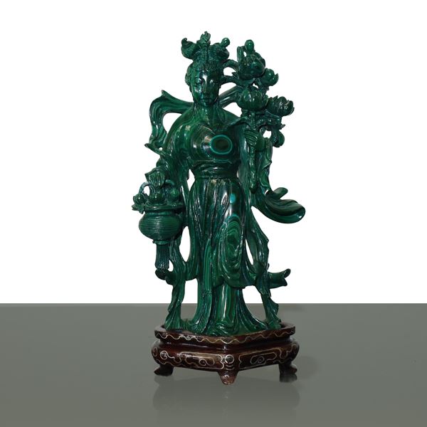 Guayin with lotus flowers and basket in hand in malachite