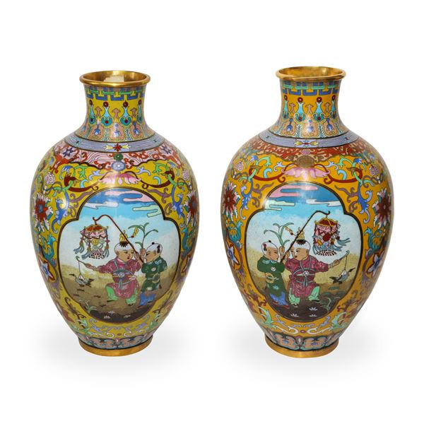 Pair of large polychrome metal vases painted with floral motifs and genre scenes on the front and back