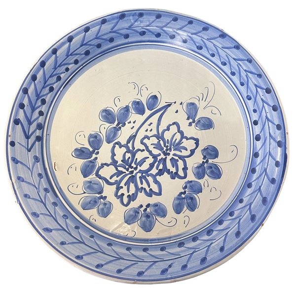 Santo Stefano di Camastra majolica plate decorated with blue floral motifs