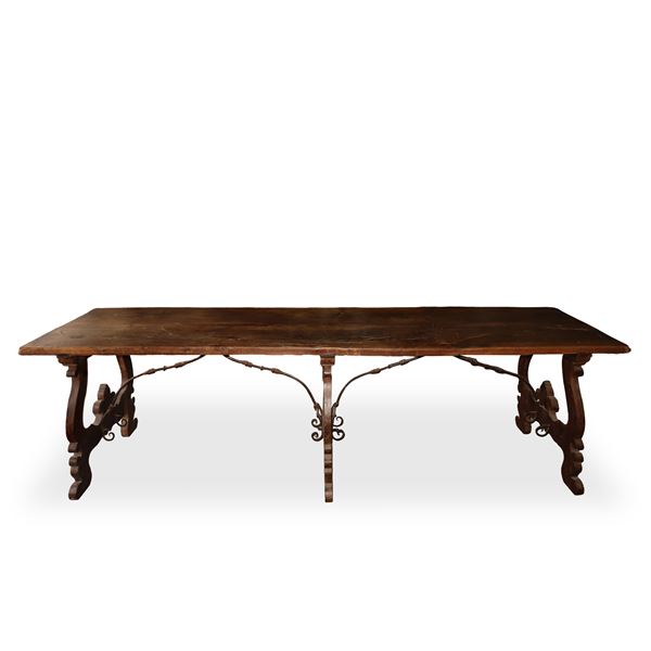 Rectangular Fratino table, walnut top, shaped feet with forged irons to support the top